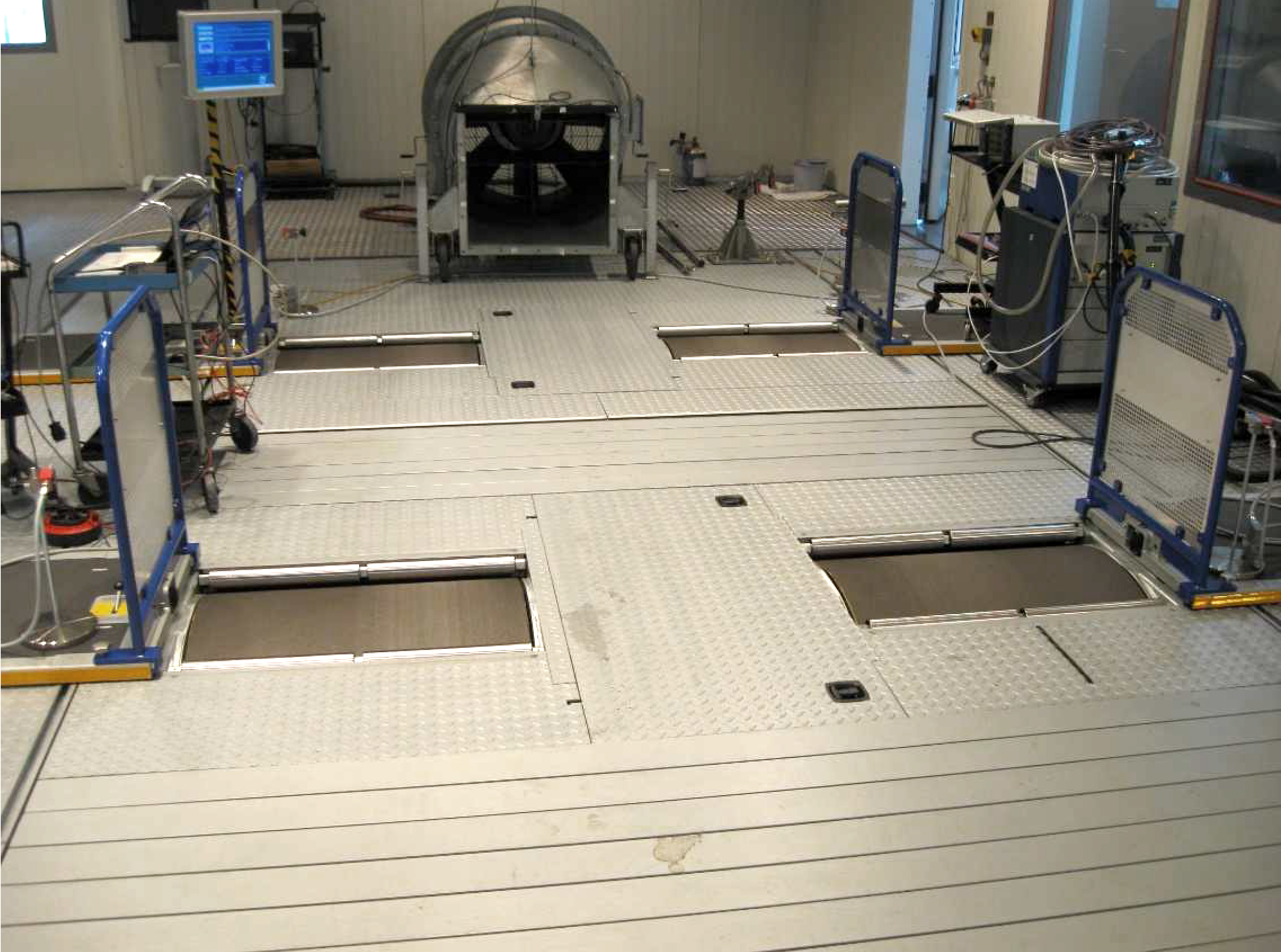 Laboratory No. 2 – view of the 4WD chassis dyno, the vehicle cooling fan and devices for performing continuous measurements of the soot concentration (right side)